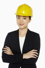 Female architect standing with arms crossed