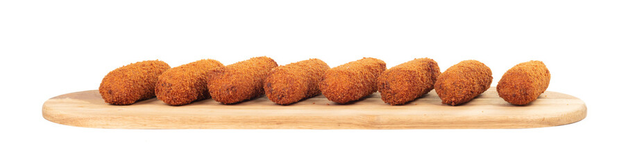 Brown crusty dutch kroketten on a serving tray isolated