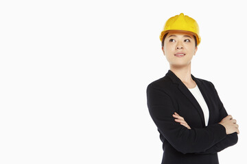 Female architect standing with arms crossed