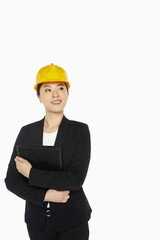 Female architect smiling and holding a folder