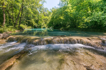 View of little waterfalls in the fluvial park of colle di val d'Elsa siena Tuscany Italy