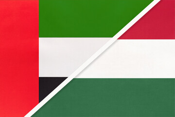 Obraz premium United Arab Emirates or UAE and Hungary, symbol of national flags from textile. Championship between two countries.
