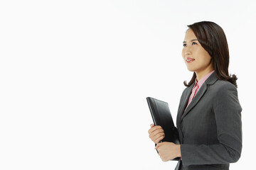 Naklejka premium Businesswoman carrying a folder