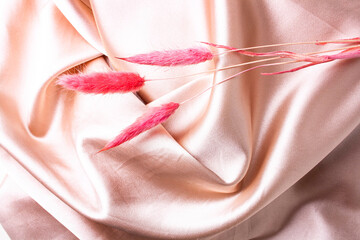 Satin fabric background. Gently peach texture