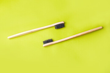 Two toothbrushes on a green background. Zero waste. Save the planet