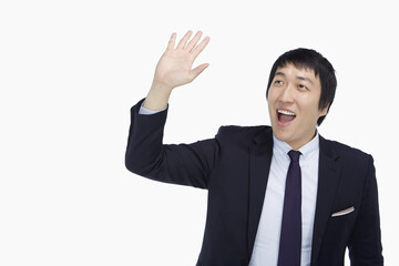 Businessman showing a waving gesture