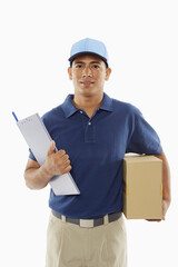 Delivery person holding a cardboard box and a clipboard