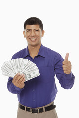 Businessman holding a lot of money