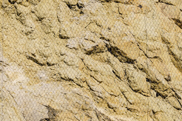 Stone wall with steel protection net