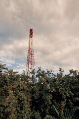 tall telecommunication pillar in nature. broadcasting equipment ground view