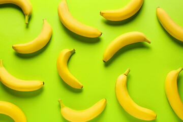 Ripe bananas on color background