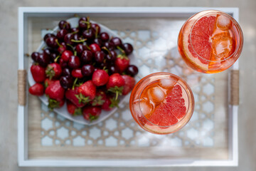 Cocktails on the tray with berry