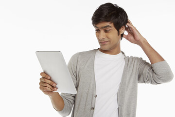 Man looking at digital tablet