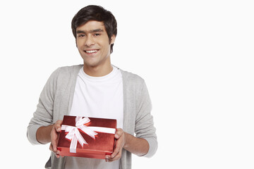 Man holding a red gift box