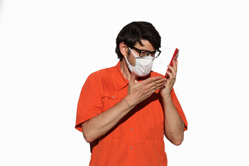 angry man on cell phone with surgical mask to protect himself fr