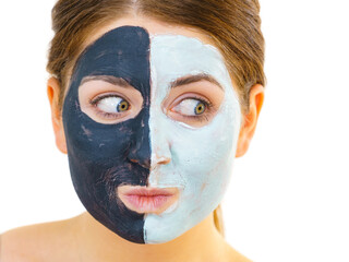 Girl with black white mud mask on face