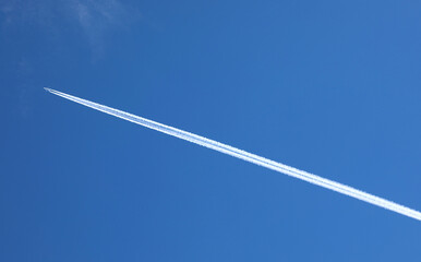 airplane while flying on the blue sky