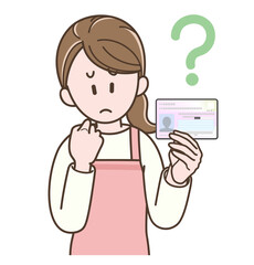 マイナンバーカードを持って悩む主婦のイラスト