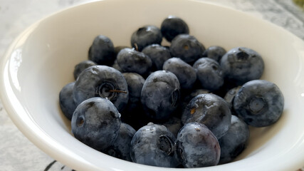 Cup of blueberries on the table
