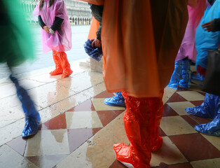 people with plastic gaiters in Venice
