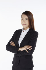 Businesswoman smiling with arms crossed