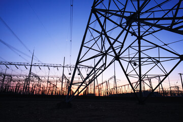 high voltage pylons in the evening