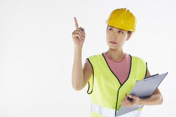 Construction worker pointing while holding a clip file