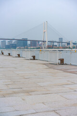The expo park along the Huangpu River,  with Nanpu bridge in the back, shot in Shanghai, China.