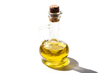 olive oil in glass jar with cork on white background