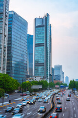 Fototapeta na wymiar Modern skyscrapers with traffic, in Shanghai, China.