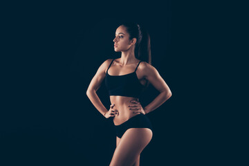 Portrait of her she nice-looking attractive gorgeous content sportive strong lady perfect shape form figure fitness bikini model body builder pilates isolated over black background