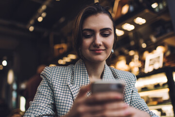 Elegant young lady using smartphone