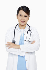 Fototapeta premium Medical personnel standing with arms crossed, smiling