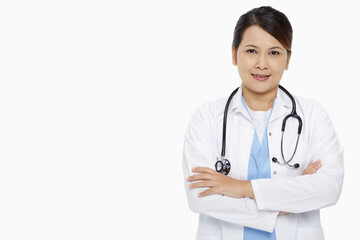 Fototapeta premium Medical personnel standing with arms crossed, smiling