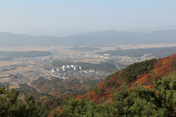 Fototapeta na wymiar Gyeongju landscape with the buildings, mountains and paddy fields in autumn from Mt. Tohamsan, South Korea