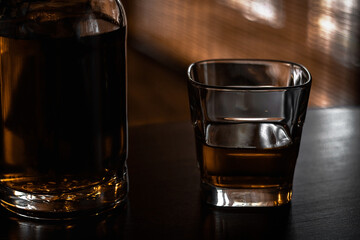 glass and bottle with scotch single malt whiskey