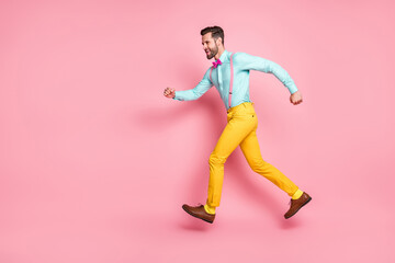 Fototapeta na wymiar Full length profile side photo of cheerful man jump run copyspace hurry discount wear shirt shoes isolated over pastel color background