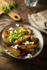 Roasted potato wedges with Feta cheese