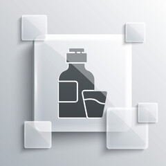 Grey Bottle of medicine syrup and dose measuring cup solid icon isolated on grey background. Square glass panels. Vector Illustration.