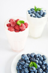 Yogurt cocktail and parfait. Natural detox. Liquid ice cream. Healthy food and breakfast. Good morning. Berry Milk Smoothie with blueberries, strawberries, raspberries. Fresh diet dessert. Summer card