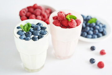 Yogurt cocktail and parfait. Natural detox. Liquid ice cream. Healthy food and breakfast. Good morning. Berry Milk Smoothie with blueberries, strawberries, raspberries. Fresh diet dessert. Summer card