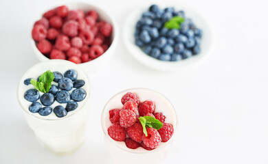 Yogurt cocktail and parfait. Natural detox. Liquid ice cream. Healthy food and breakfast. Good morning. Berry Milk Smoothie with blueberries, strawberries, raspberries. Fresh diet dessert. Summer card