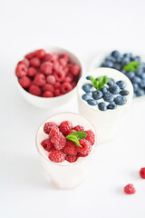 Yogurt cocktail and parfait. Natural detox. Liquid ice cream. Healthy food and breakfast. Good morning. Berry Milk Smoothie with blueberries, strawberries, raspberries. Fresh diet dessert. Summer card