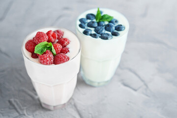 Yogurt cocktail and parfait. Natural detox. Liquid ice cream. Healthy food and breakfast. Good morning. Berry Milk Smoothie with blueberries, strawberries, raspberries. Fresh diet dessert. Summer card