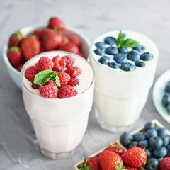 Yogurt cocktail and parfait. Natural detox. Liquid ice cream. Healthy food and breakfast. Good morning. Berry Milk Smoothie with blueberries, strawberries, raspberries. Fresh diet dessert. Summer card