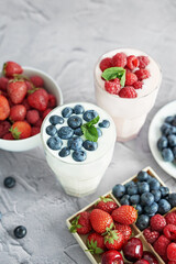 Yogurt cocktail and parfait. Natural detox. Liquid ice cream. Healthy food and breakfast. Good morning. Berry Milk Smoothie with blueberries, strawberries, raspberries. Fresh diet dessert. Summer card