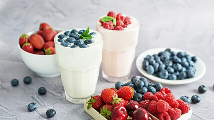 Yogurt cocktail and parfait. Natural detox. Liquid ice cream. Healthy food and breakfast. Good morning. Berry Milk Smoothie with blueberries, strawberries, raspberries. Fresh diet dessert. Summer card