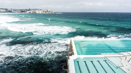 Rough sea with turquoise tones and white foam from the waves