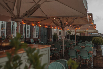 Selective focus of lighting on umbrellas of outdoor cafe in Copenhagen, Denmark