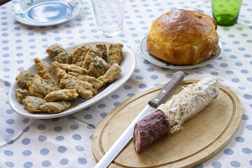 table set with salami and frying